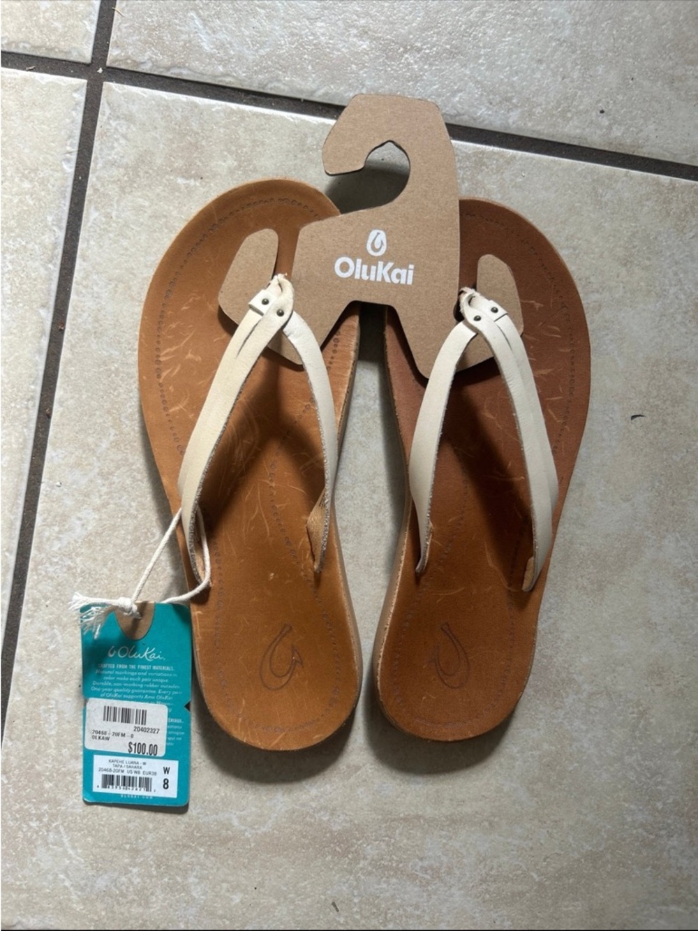 OluKai Women size 8 tan/white NWT- Kapehe Luana Flip Flop sandles- Tapa/Sahara